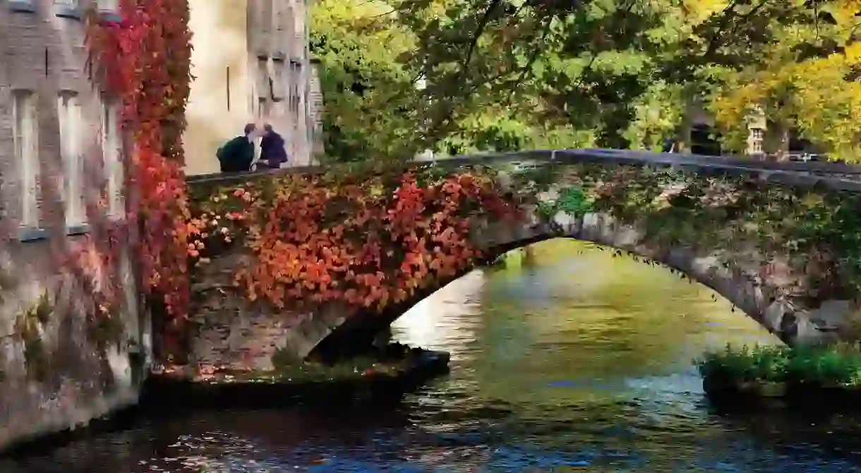 A couple enjoying Bruges romantic canals