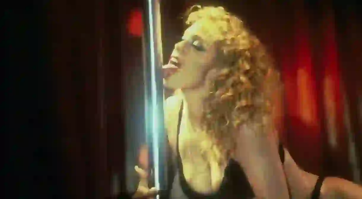 Elizabeth Berkley displays her pole dancing skills in Showgirls