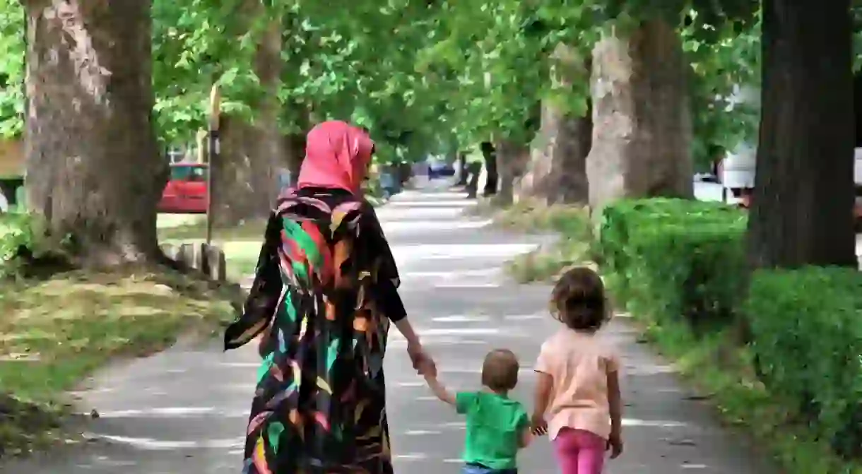 Muslim mother with her son and daughter