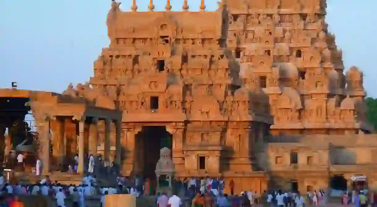 Devotees at the entrance of the Brihadeeswara Temple in Thanjavur India