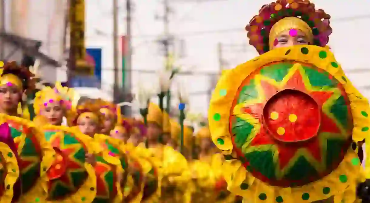 Dancers in costume at Kadayawan Festival, Philippines