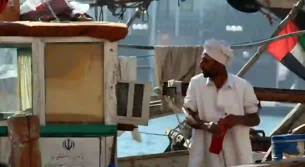 A traditional dhow boatman at work in Dubai