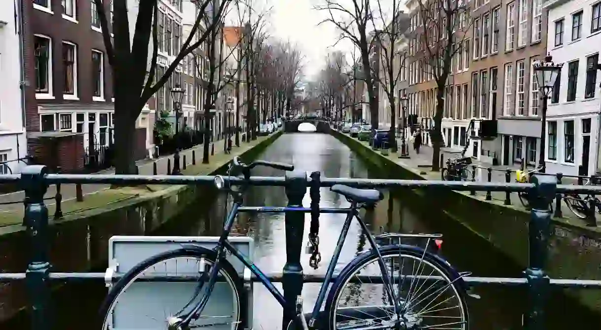 A bike chained to a bridge on Amsterdams canals