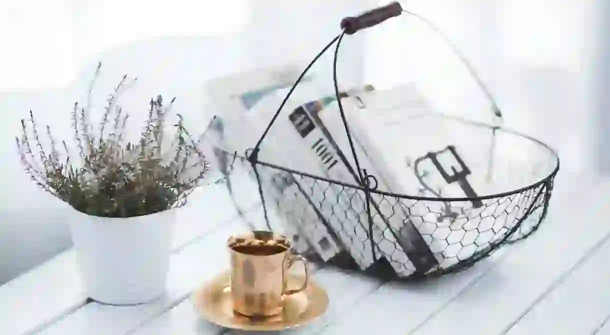 Golden cup and basket with books