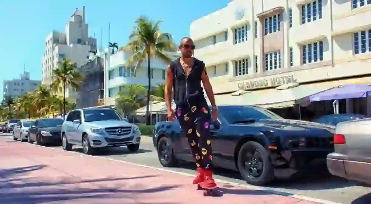 Man in PJs skating down Miami Beach