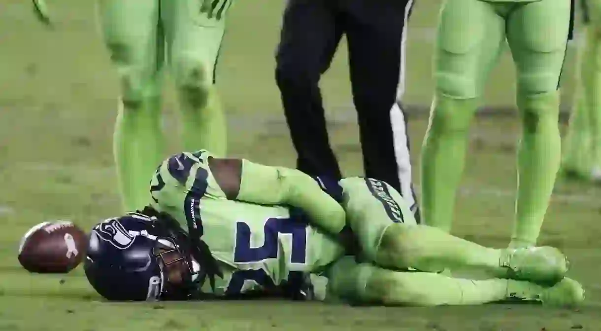 Seattle Seahawks Richard Sherman lays on the ground injured