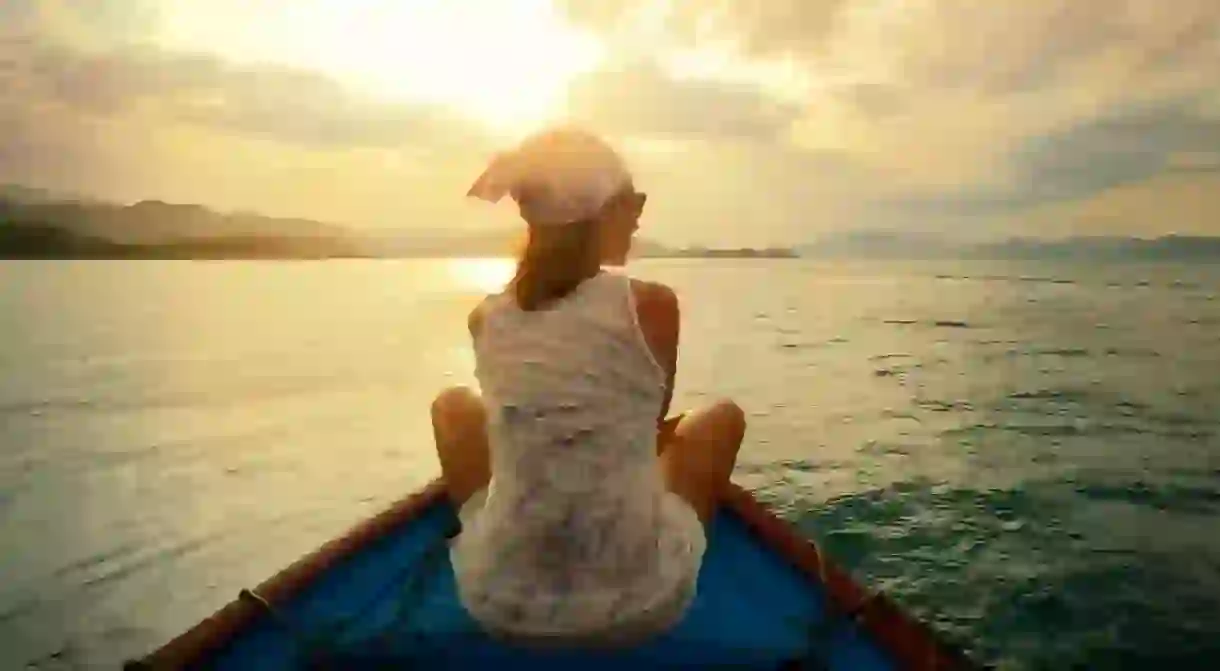 Traveling by boat at sunset