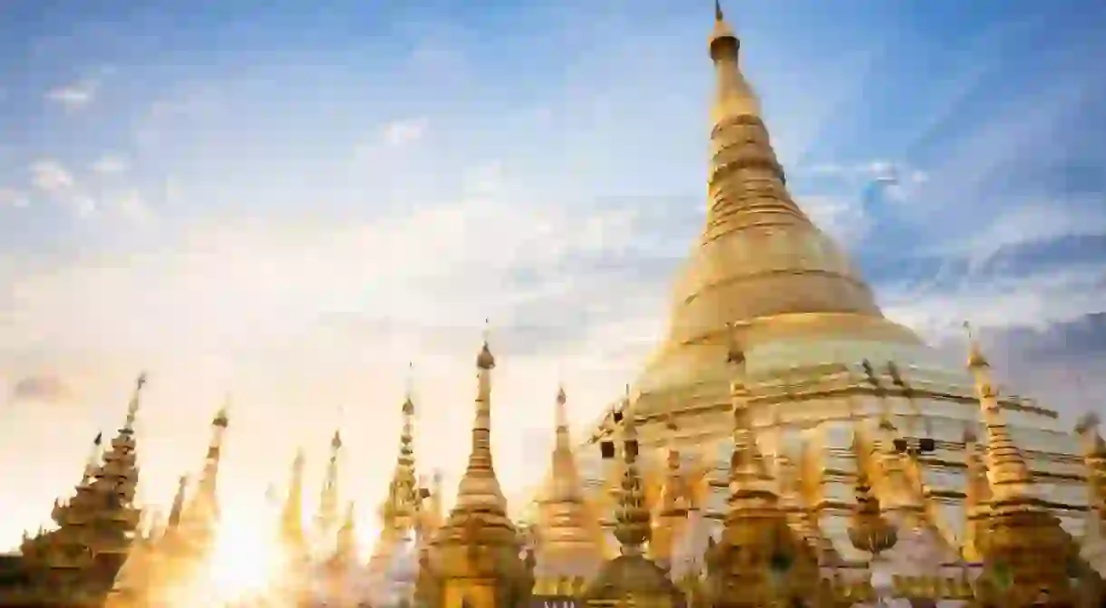 The sun sets behind the Shwedagon Pagoda in Yangon, Myanmar