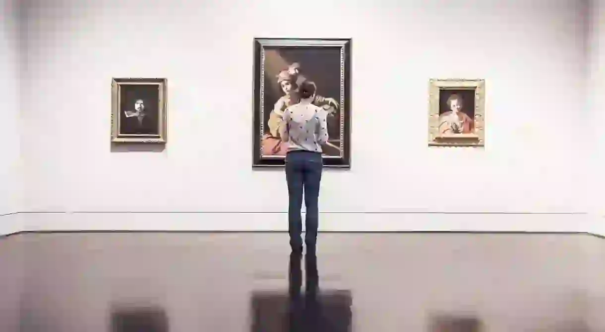 A woman looking at art