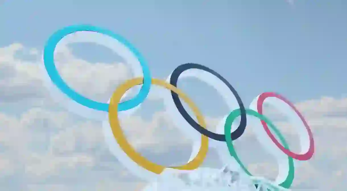 Blue sky and symbol of Olympic Games in Ice town