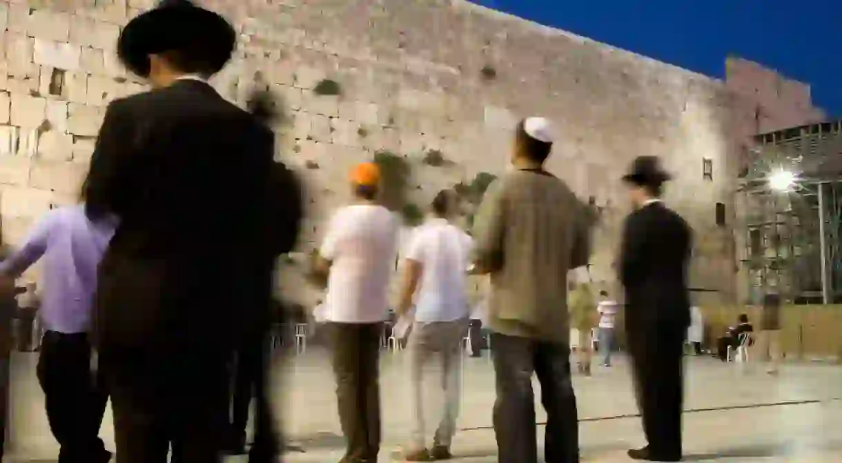 Men praying at the Western Wall, Jerusalem, Israel