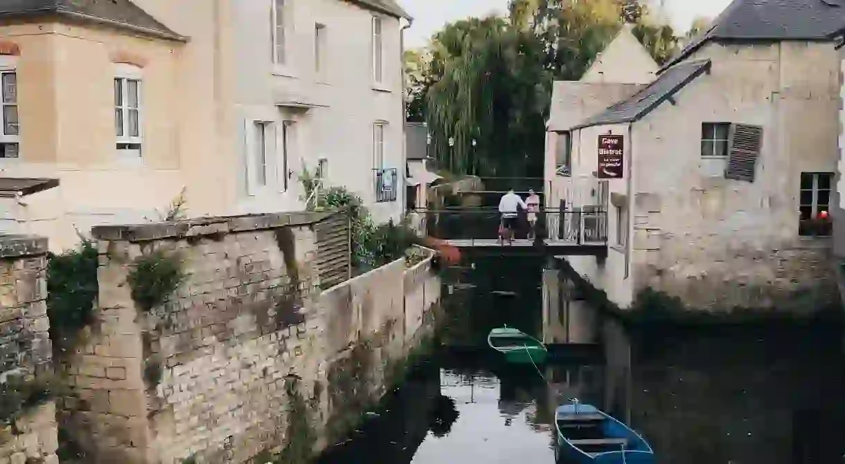 Old water canal in city of Bayeux, Normandy, France