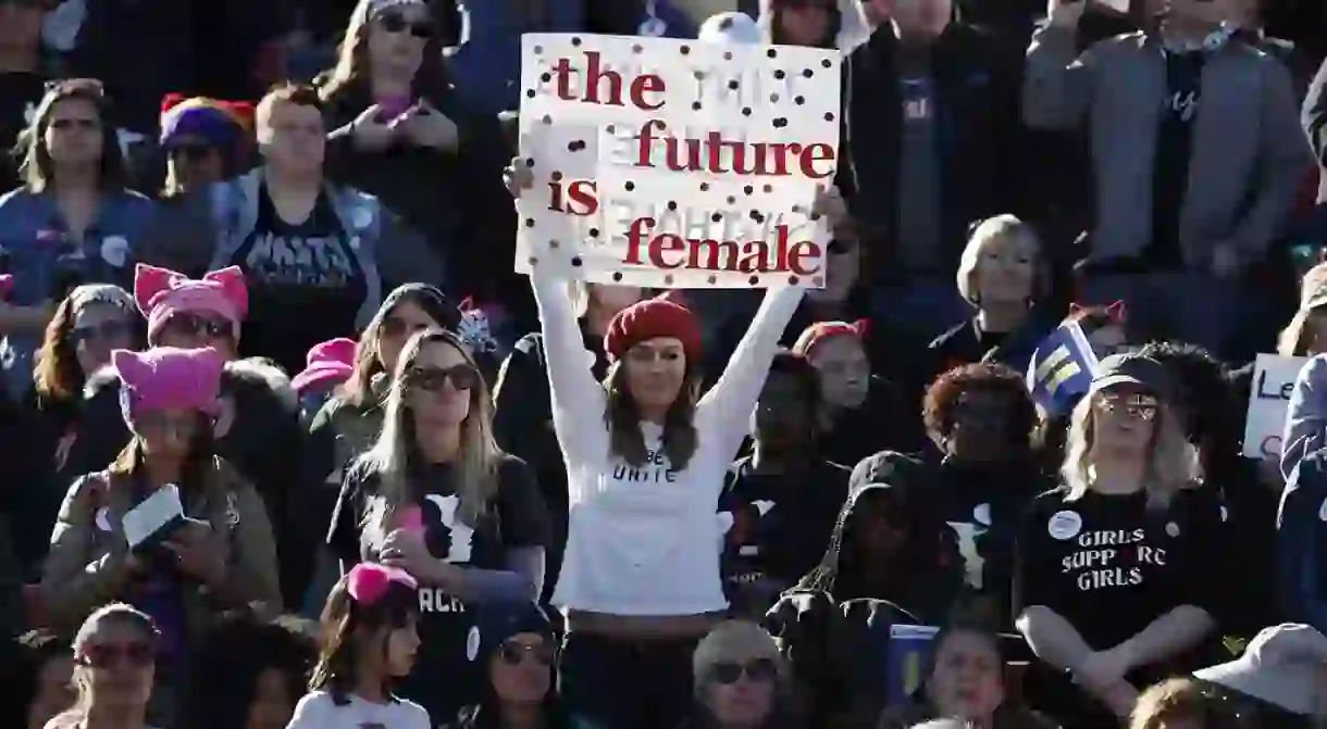 People cheer during a womens march rally, Las Vegas