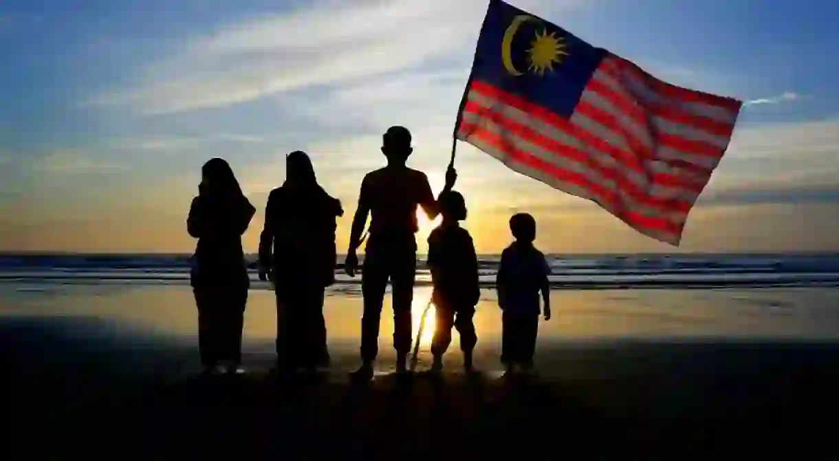 Family and Malaysian flag