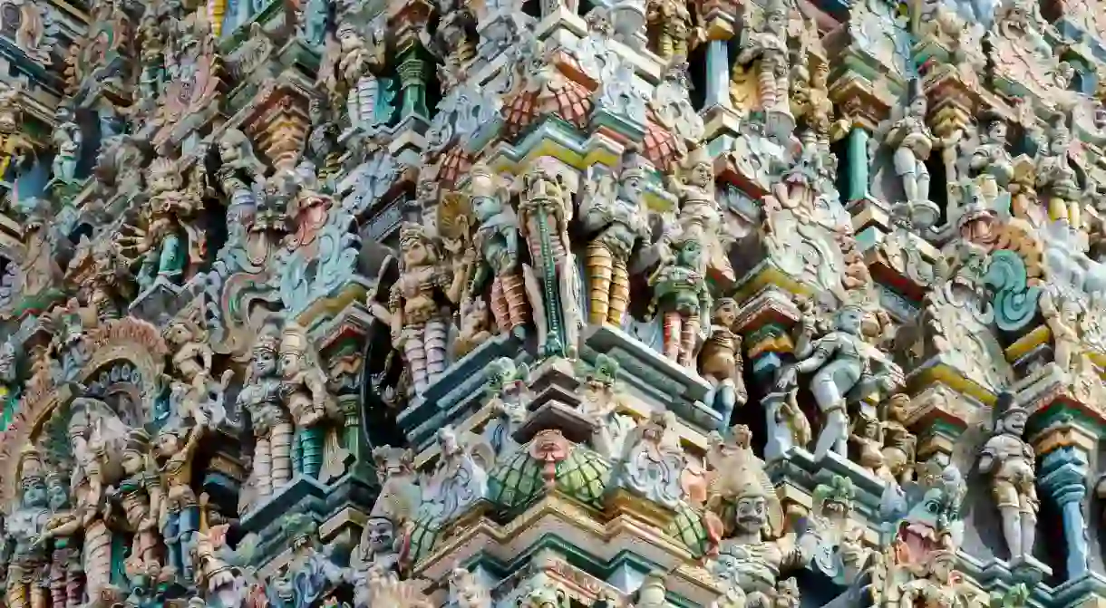 Elaborate carving on a gopuram or gateway tower of Madurai Meenakshi Temple