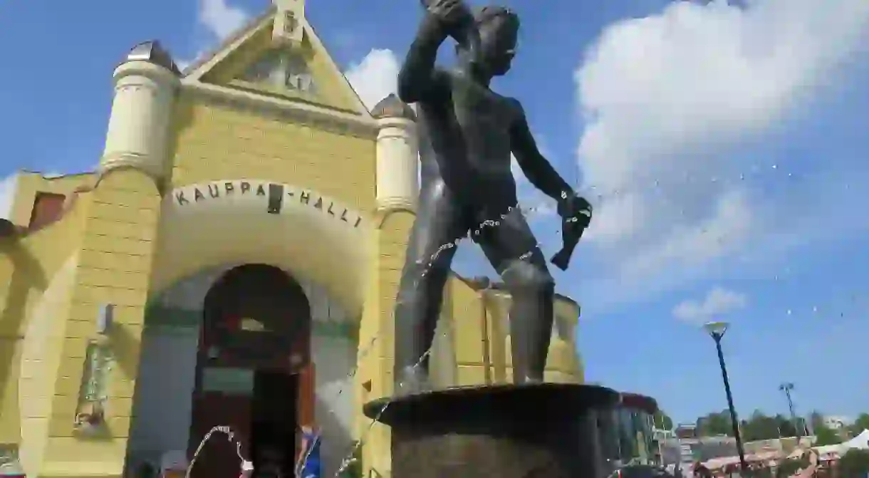 Statue of Veljimies and Market Hall in Kuopio