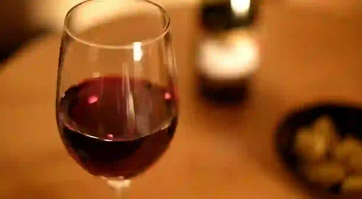 A glass of red wine enjoyed at dinner