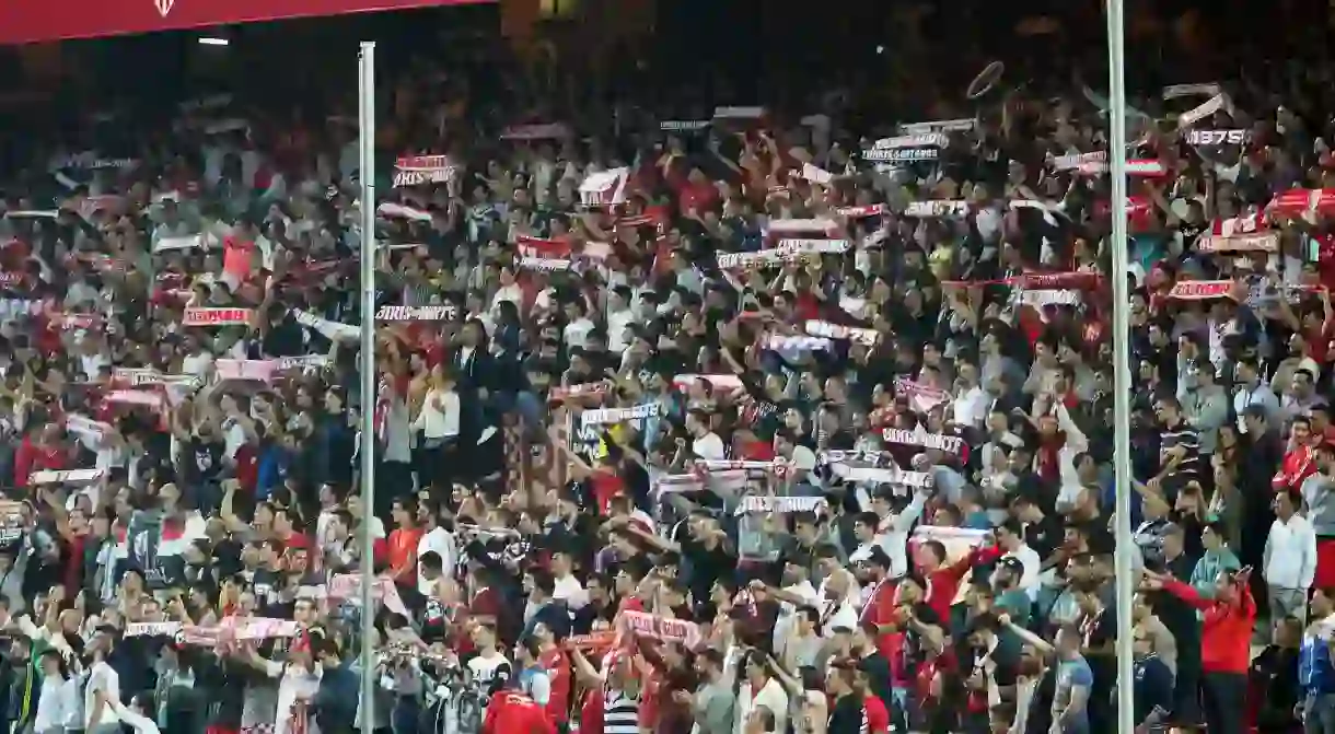 Sevilla FC fans support their team during a home match