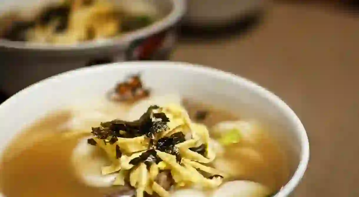 Tteokguk, or rice cake soup, plays an important role in Koreas traditions.