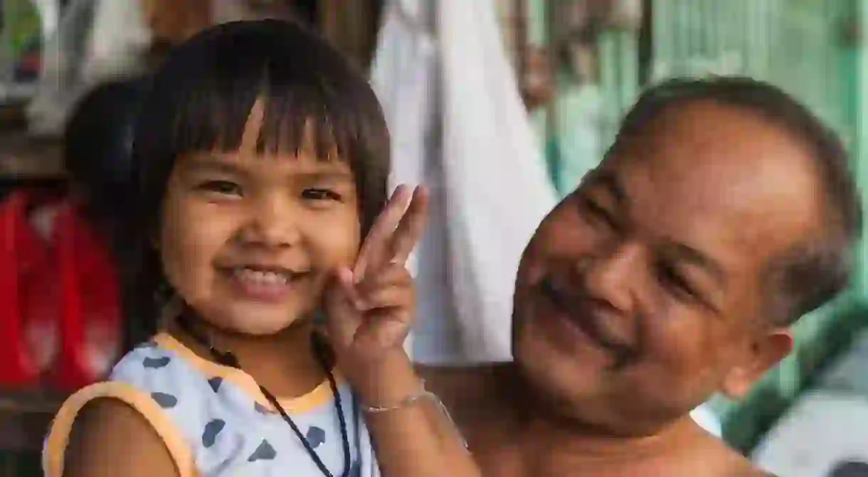 A Thai man and young child