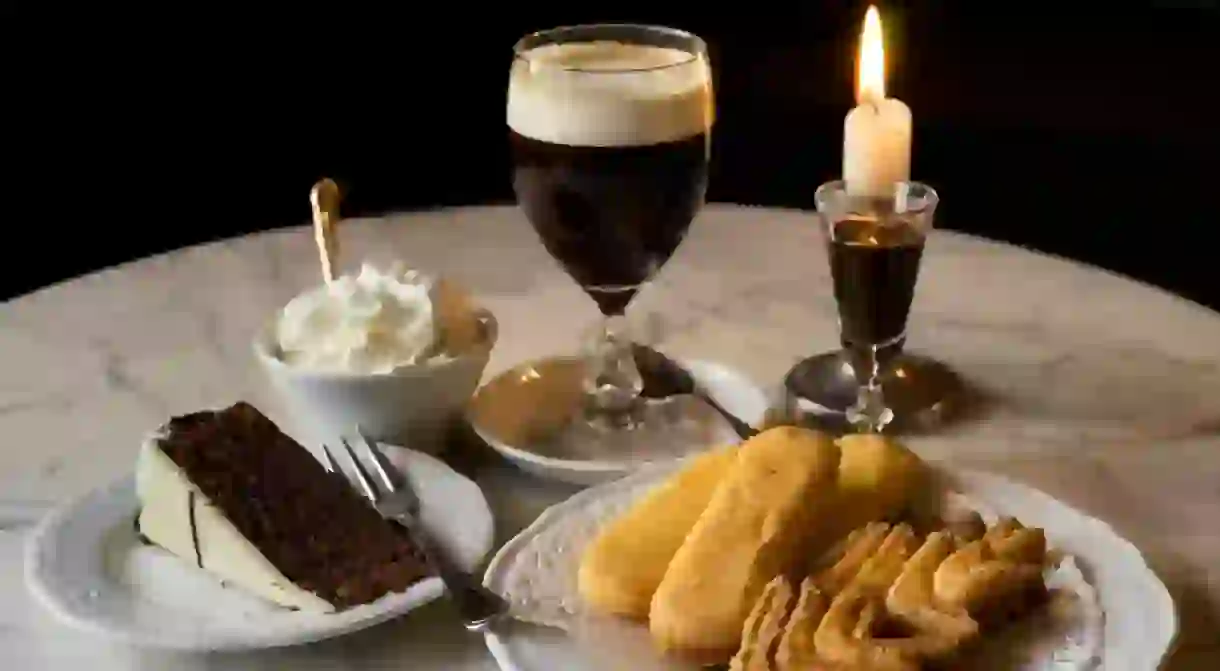 The classic Bicerin drink accompanied by chocolate hazelnut cake and traditional biscuits, chocolate and cream at Caffé Al Bicerin