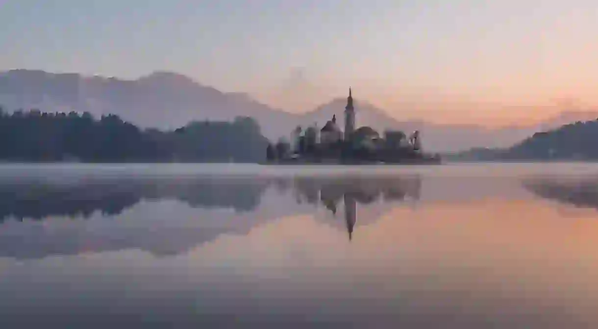 Magical Lake Bled is just one of Slovenias breathtaking honeymoon destinations.