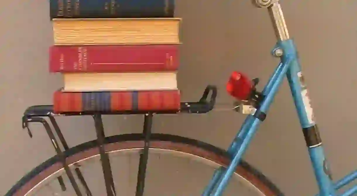 Books stacked on bicycle