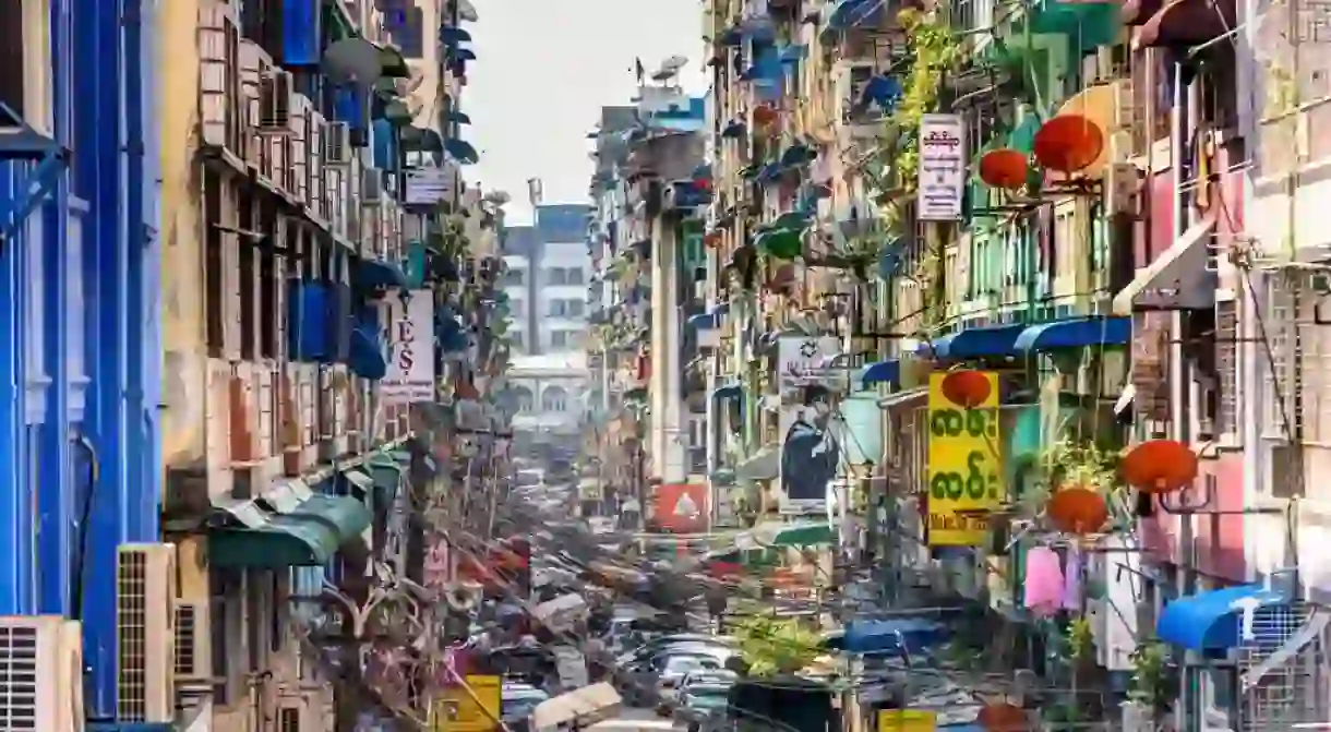 A congested, colorful alleyway in downtown Yangon, Myanmar