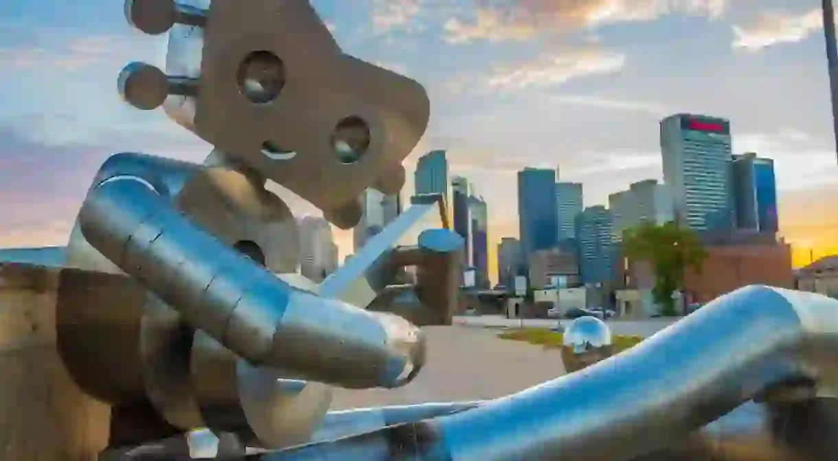 Waiting on a Train is the second sculpture in The Traveling Man series in Deep Ellum