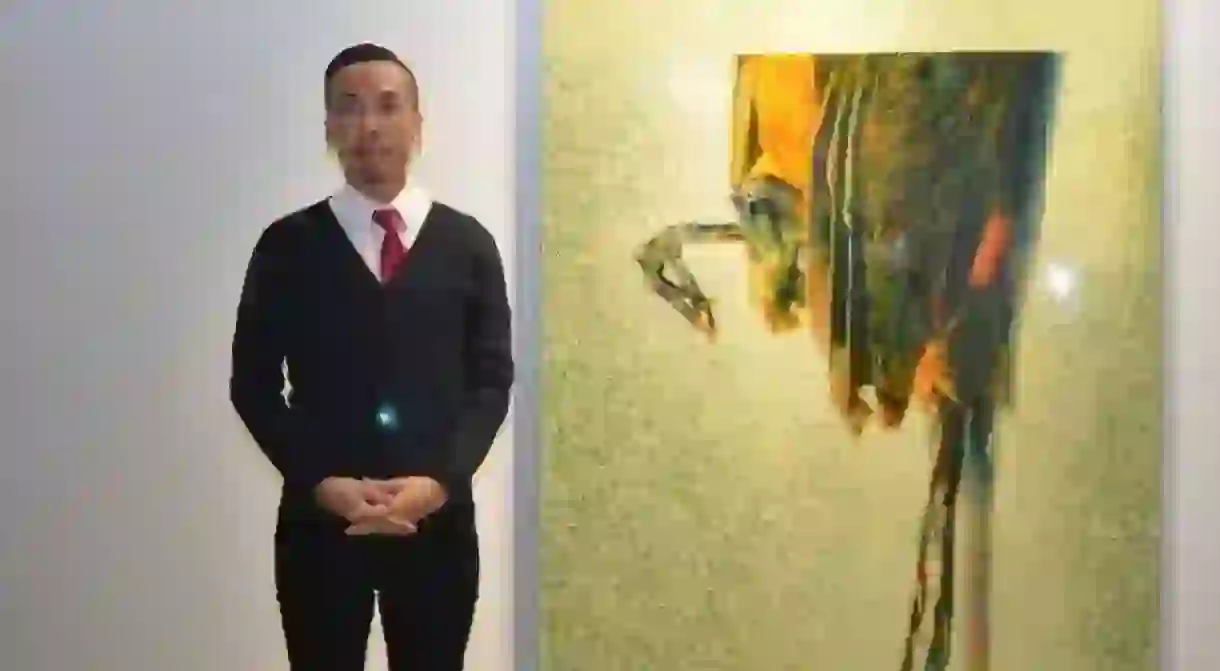 Ivan Lam with his artwork