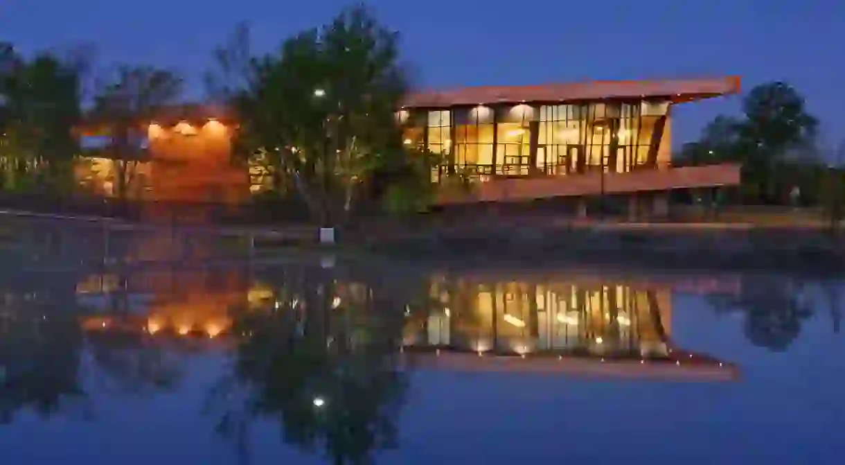 Trinity Audubon Nature Center lit up at night