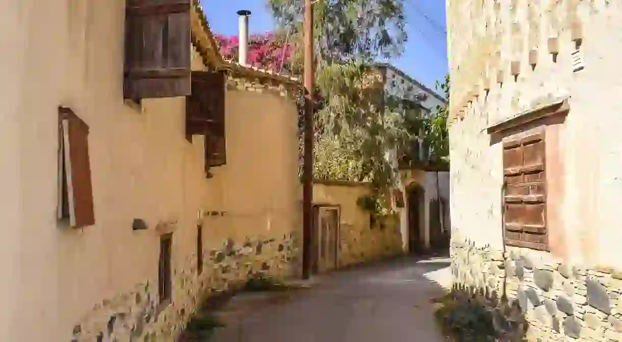 A narrow backstreet between old houses