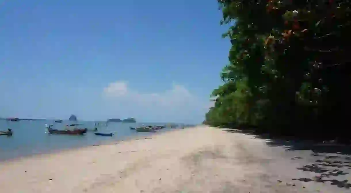 Fishermen boats near the shores of Black Sand Beach, Langkawi