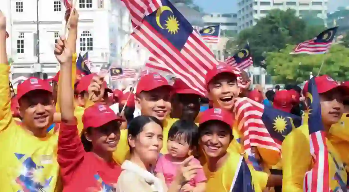 Patriotic volunteers celebrating their country indepence day at the iconic site Merdeka square, Kuala Lumpur, Malaysia