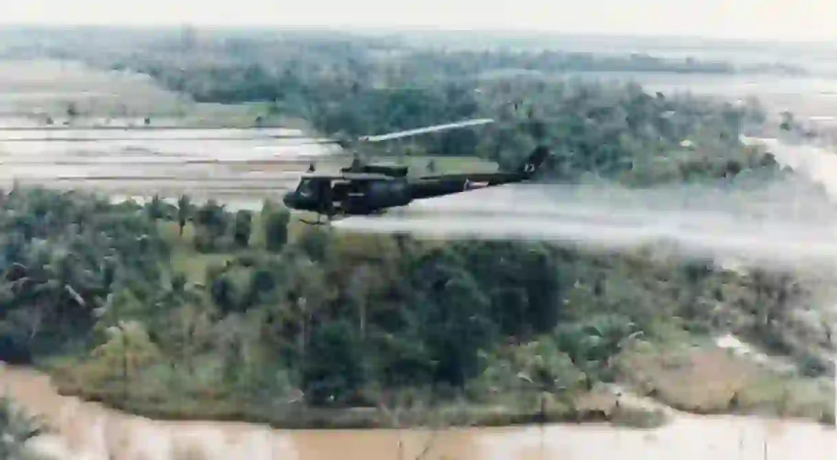 U.S. Huey helicopter spraying Agent Orange in Vietnam