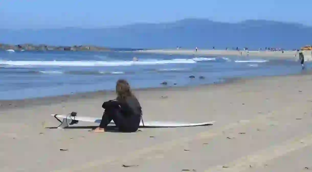 A surfer girl contemplates