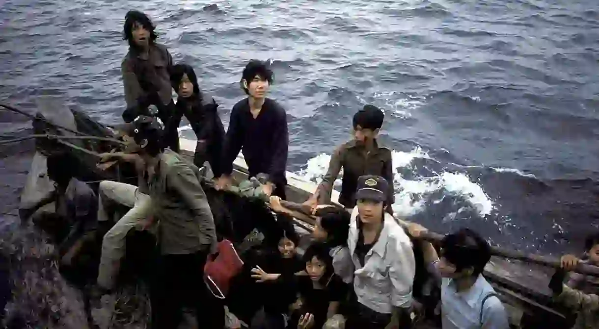 Vietnamese refugees fleeing their homeland by boat