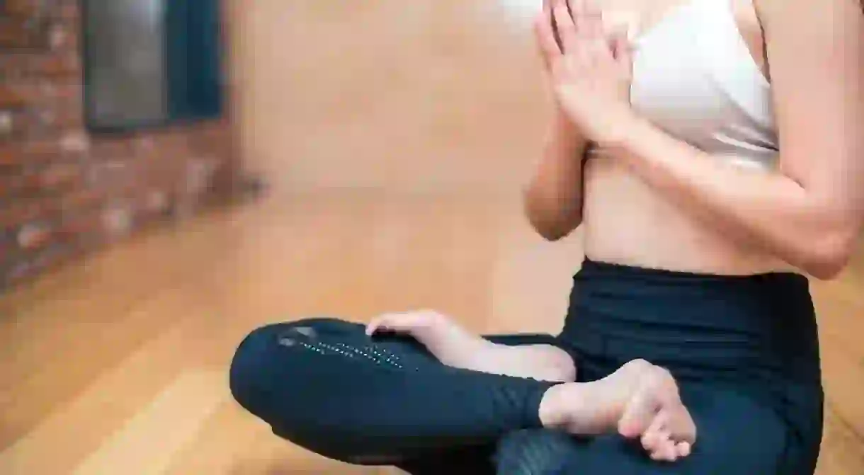 Meditating at the start of a yoga class