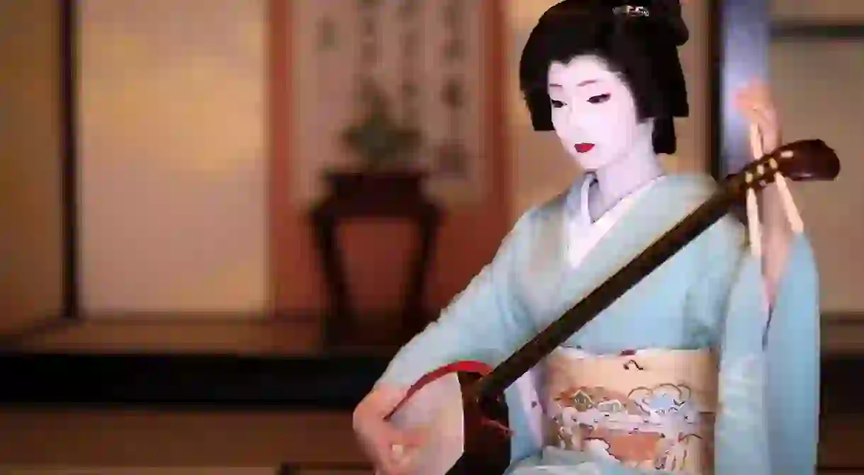 Toshimana, a Kyoto Geiko, plays the shamisen