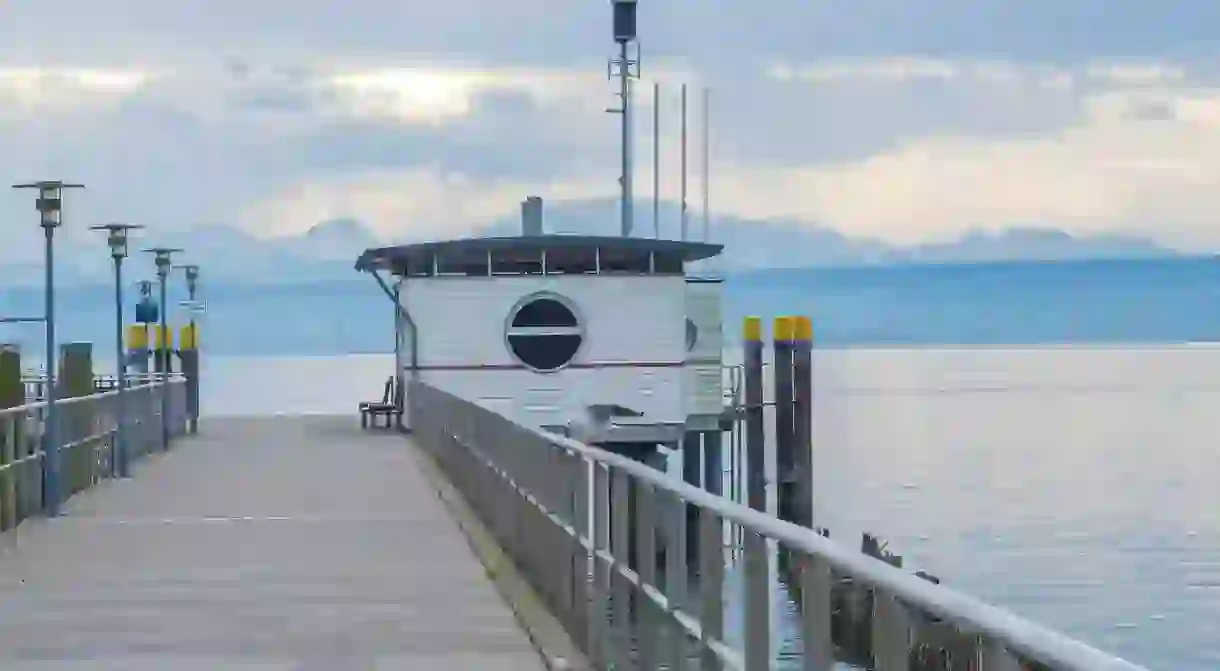 A ferry port on Lake Constance with the majestic Alps in the background