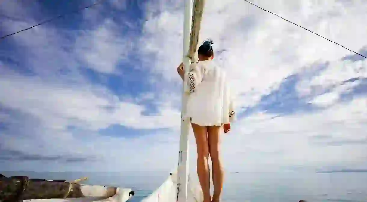 Woman standing on the bow of a bangka