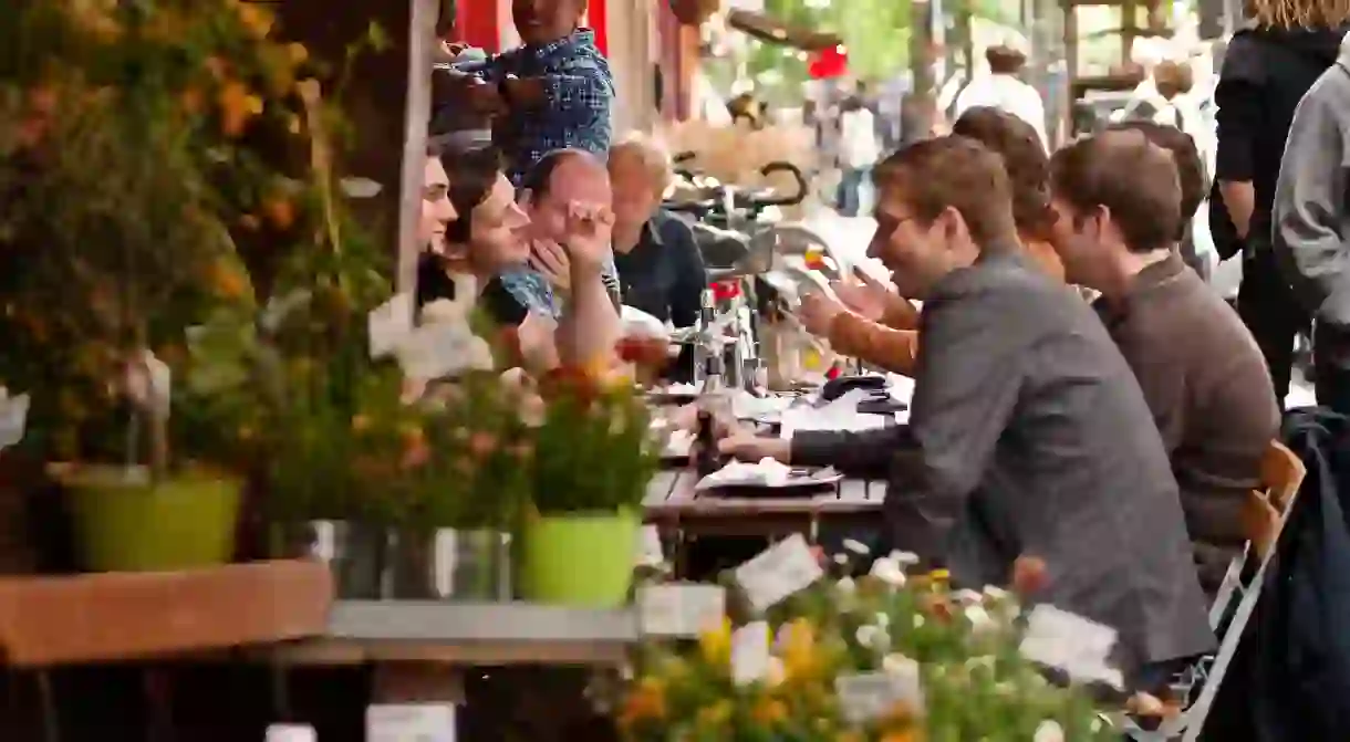 A group of friends enjoy lunch in the sun in Berlin