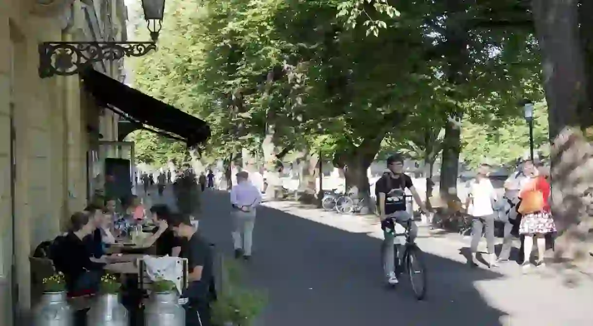 Cycling along Aura River in Turku, Finland.