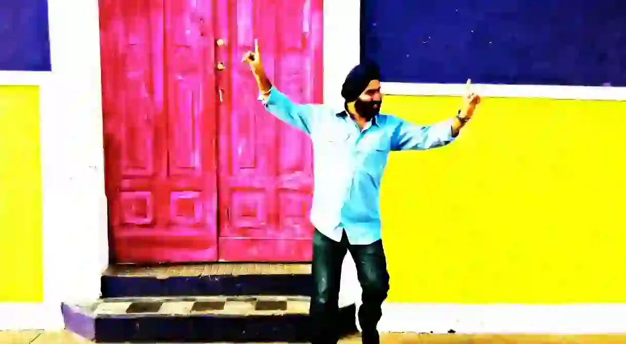 A Punjabi man dancing and having fun