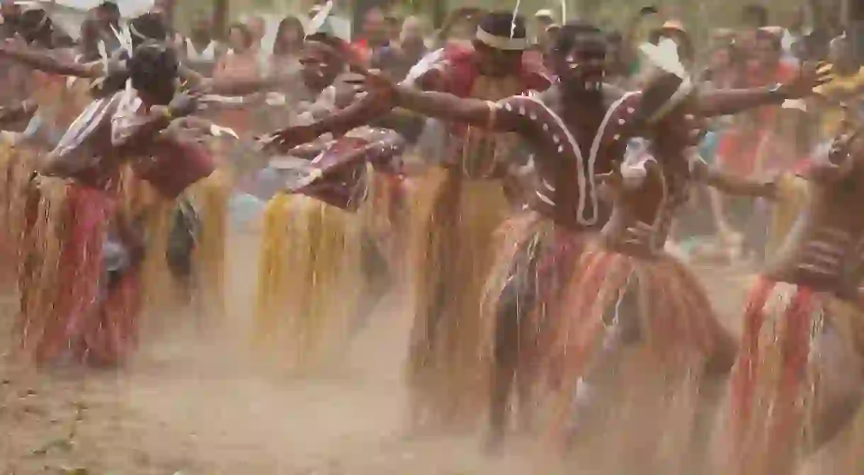 Indigenous Australians perform a cultural ceremony