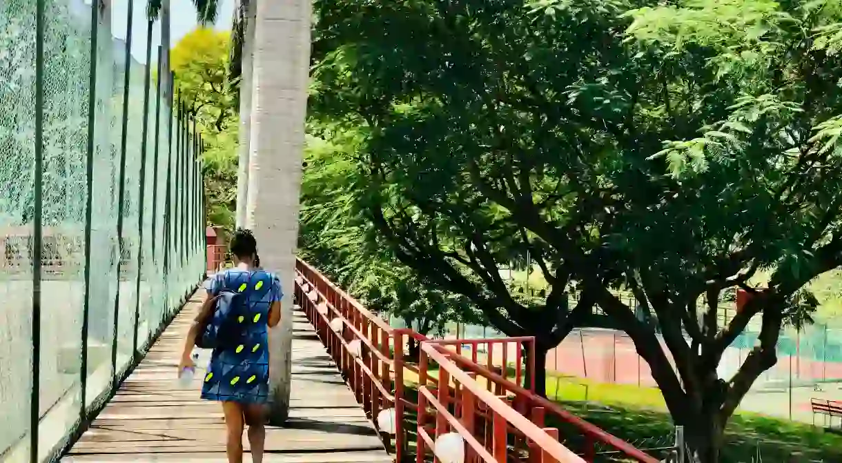 Woman walking in a park in Abuja