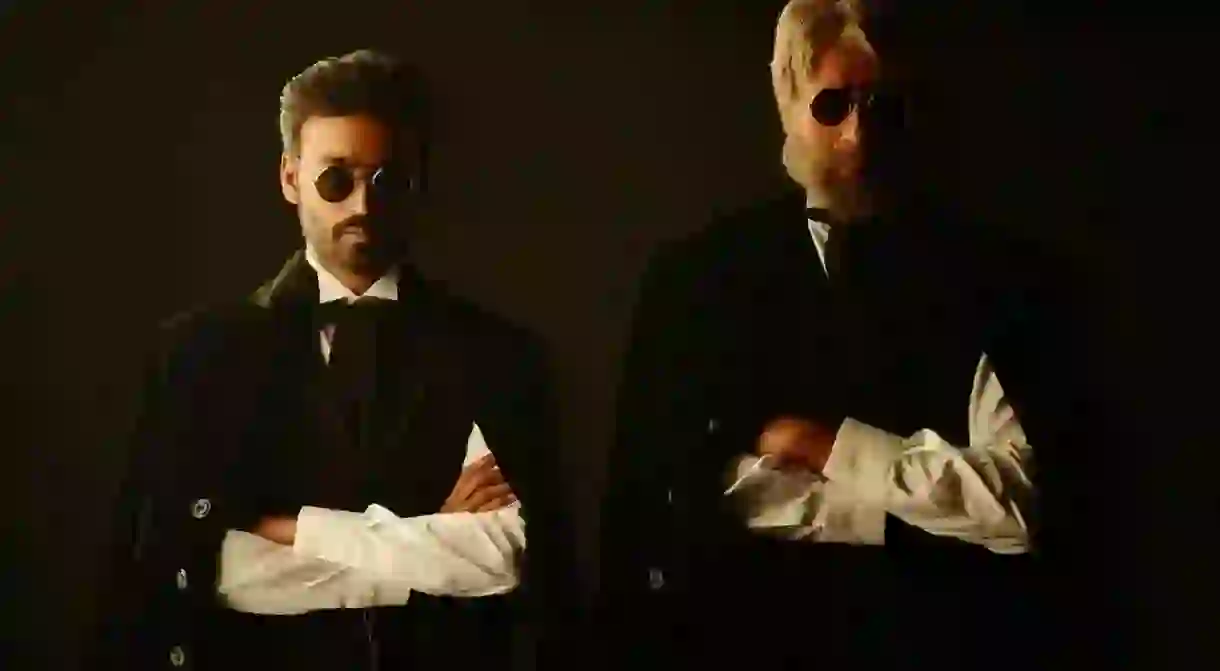 Actor Dhanush (Left) alongside veteran actor Amitabh Bachchan in a still from his last Bollywood release Shamitabh