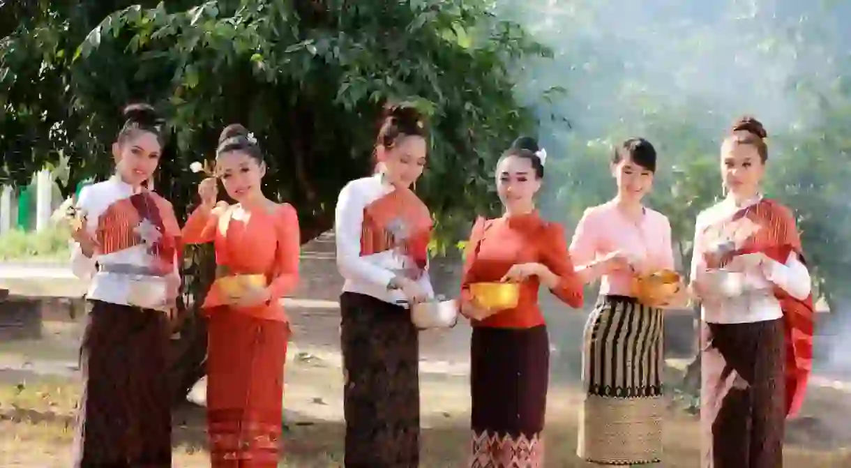 Women wearing Thai national dress at the Songkran Festival, Thailand