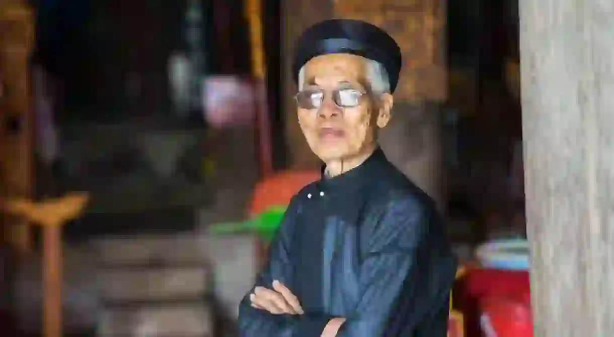 Vietnamese man wearing traditional dress and turban