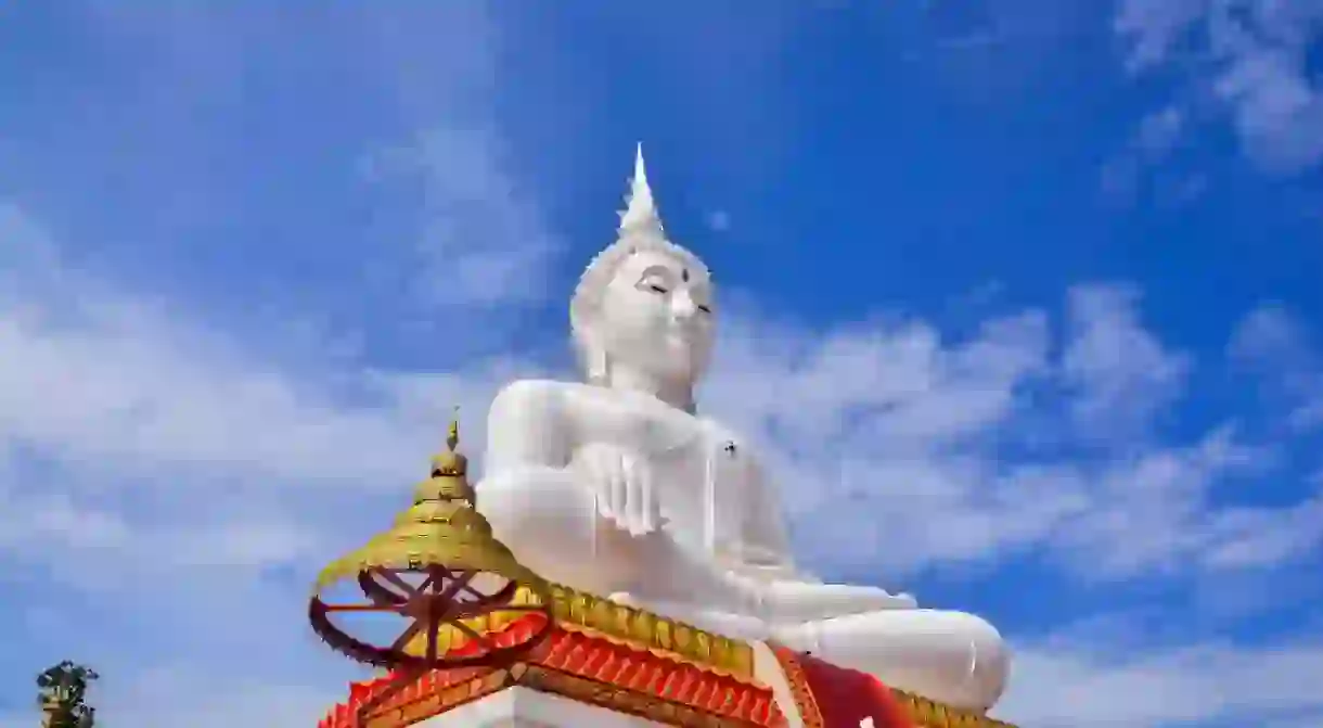 Wat Pho Kao Ton Buddhist Temple White Buddha statue in Singburi, Thailand